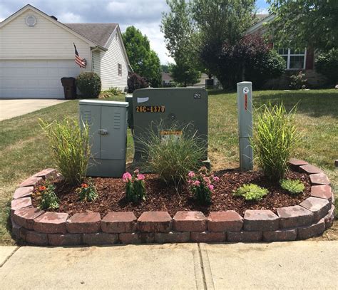 artificial plants to cover electrical box|hiding utility boxes in garden.